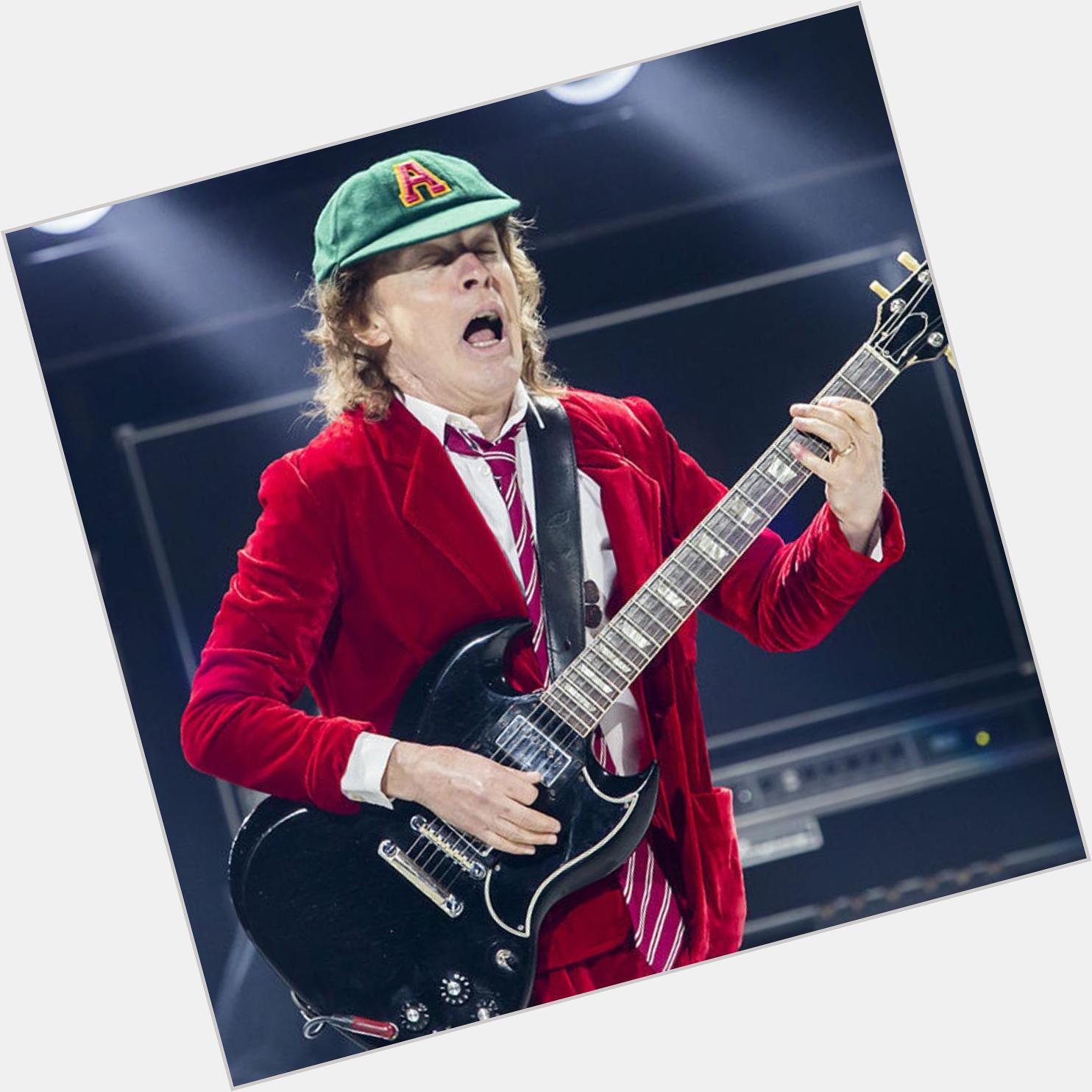 Happy 66th birthday to schoolboy Angus Young! 