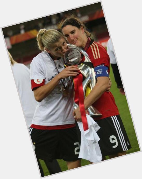 Birgit Prinz with baby Schmiddo at Euro 2009. and once again, Happy Birthday Biggi ! 