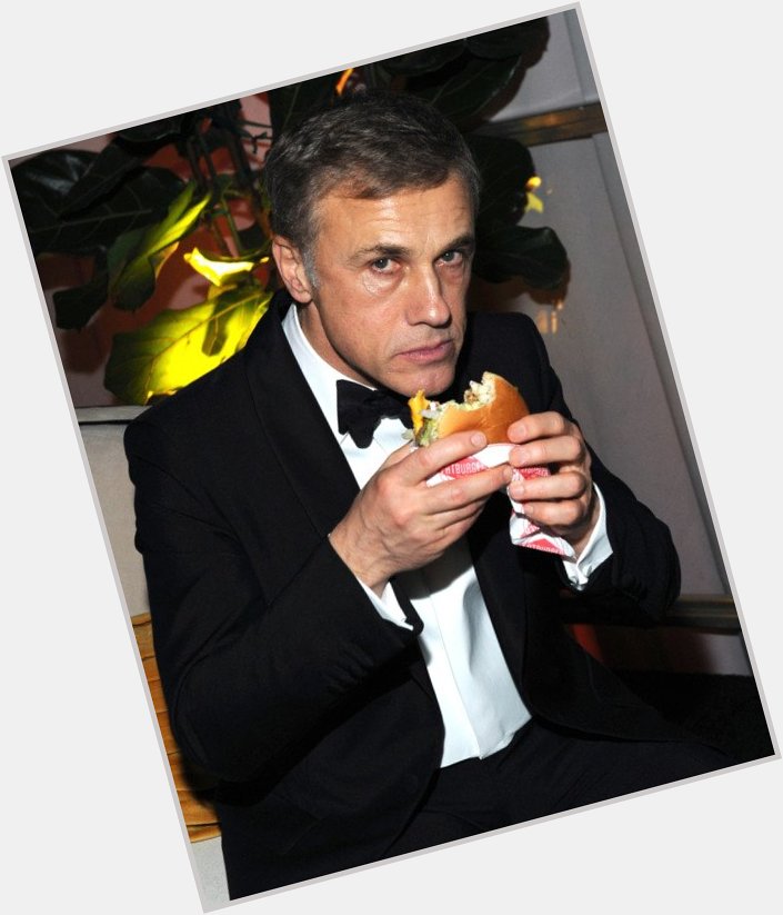 Happy birthday, Christoph Waltz! Here\s an iconic image of him eating a burger at a 2015 Golden Globes afterparty 