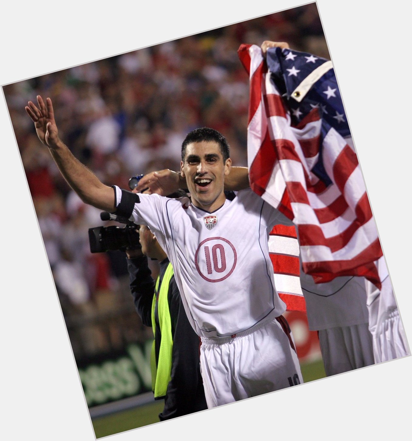 112  caps.
4 and wore the armband at 2 of them. 

Happy Birthday, Claudio Reyna! 