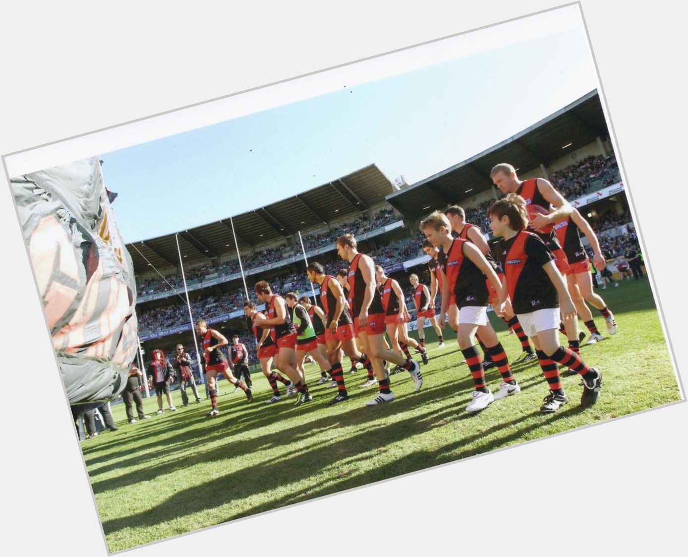 Happy Birthday young Dustin Fletcher. Here he is guiding my 2 boys thru banner V Freo, such a gentleman 