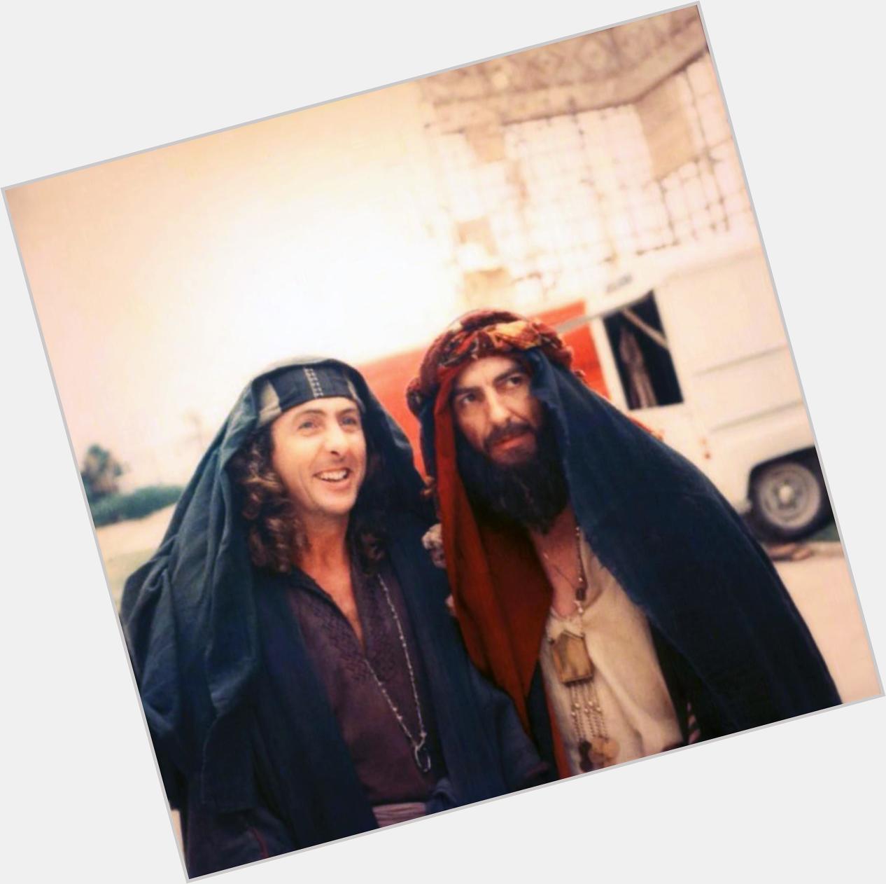   Eric Idle and George Harrison on the set of Life Of Brian.  happy Birthday 