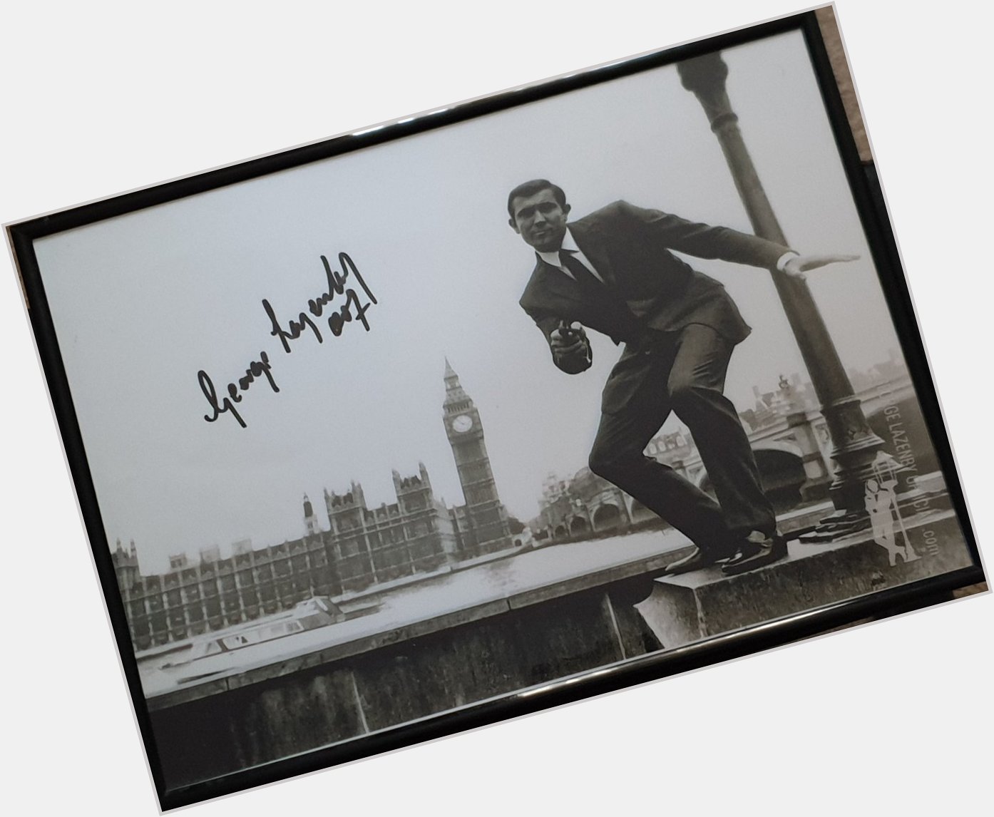 I got this signed photo from George Lazenby\s site. I enlarged it and framed it. Happy birthday George! 