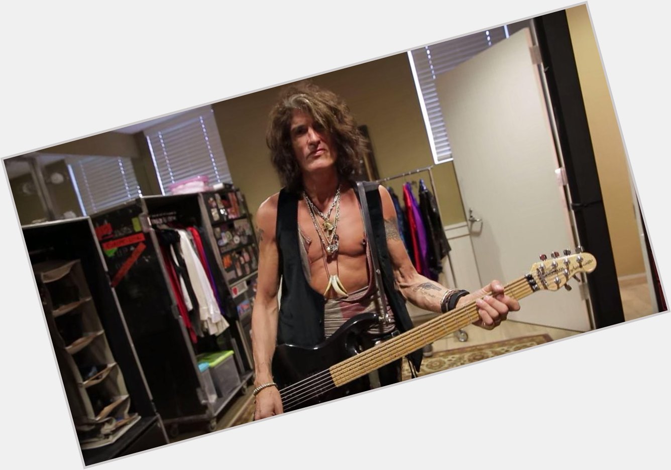 WATCH: Shows Off His Guitar Backstage  