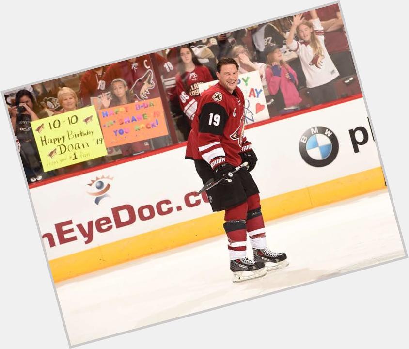 Shane Doan smiles as he skates past fans holding up sign wishing him a happy birthday during warmups 