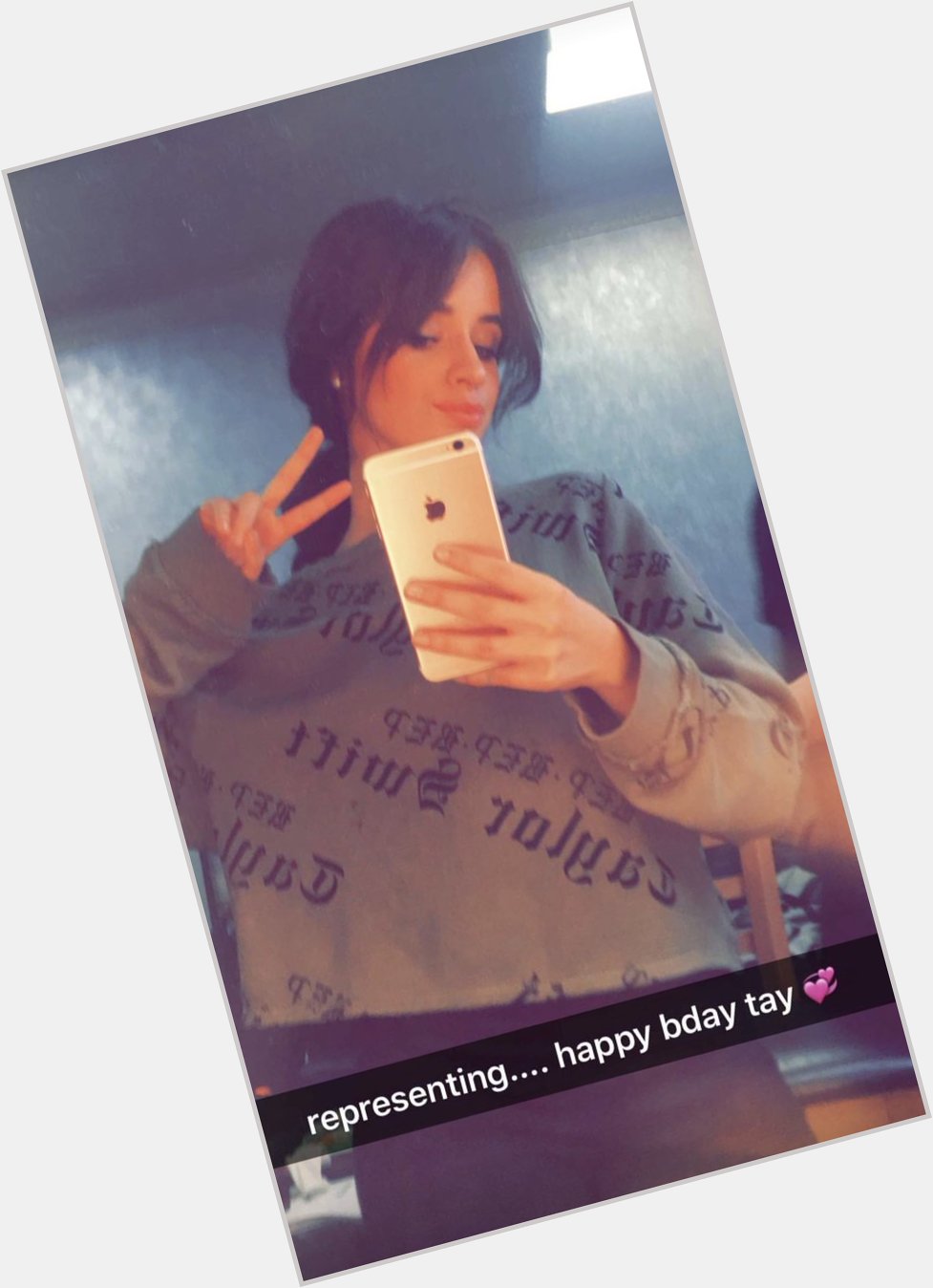 Camila Cabello wishes Taylor Swift a happy birthday while wearing her merch. 