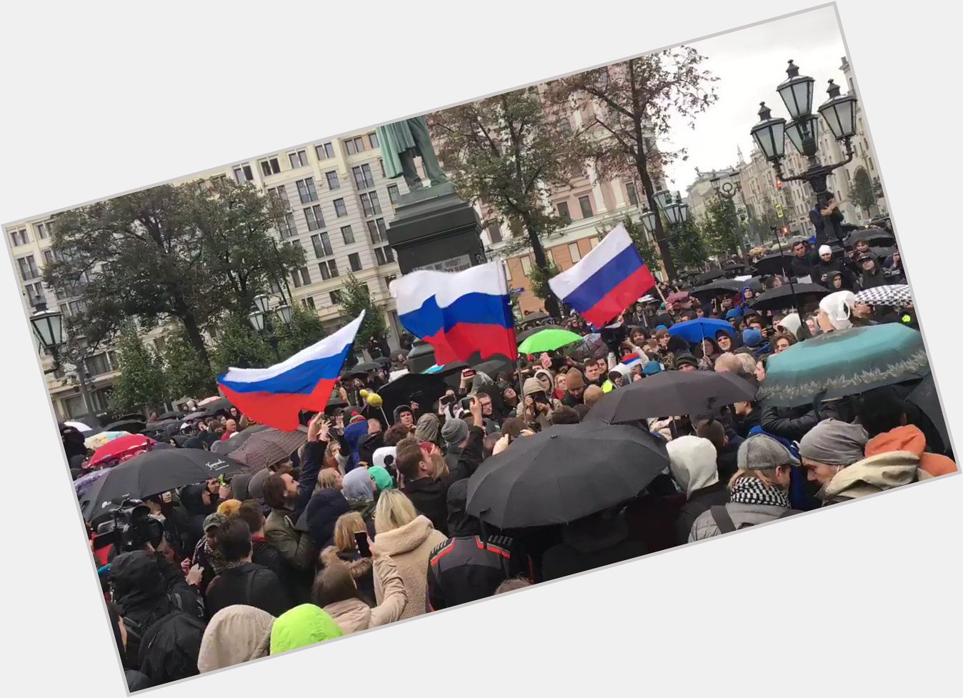 Few hundred at protest. Crowd chanting \Happy Birthday\ (to Vladimir Putin) 