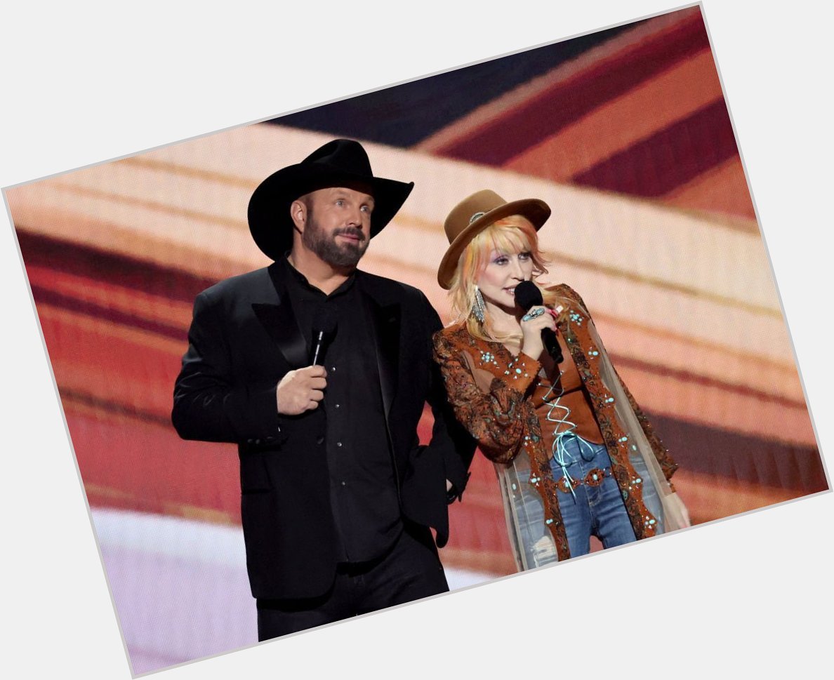 Dolly and Garth Brooks wishing Willie Nelson a happy 90th birthday on the 2023 ACM Awards. : Theo Wargo 